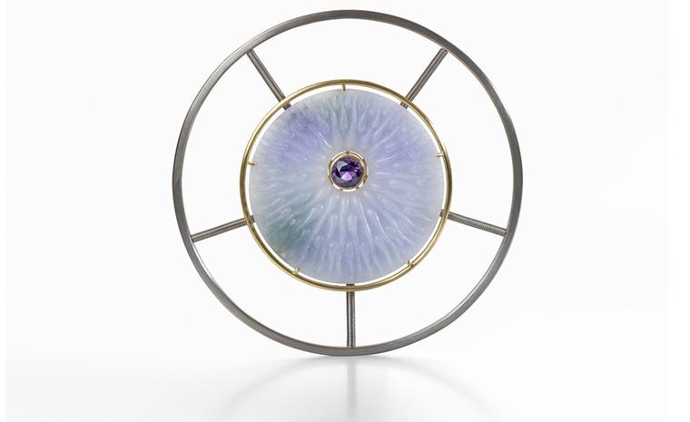 Silipis brooch by Nicholas Yiannarakis. The brooch is made of Burmese Jadeite Jade, a brilliant cut Uruguayan Amethyst, 18ct. Yellow and White Gold. Price from £16,000