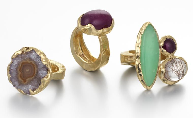 Recent graduate Milly Swire’s “Liquid” collection. left to right: Rosalie ring, yellow gold set with a rough amethyst. £1,300. Mildred ring, yellow gold set with a cabochon ruby, rutilated quartz and chrysoprase Price from £1,850. Bridget ring, ...
