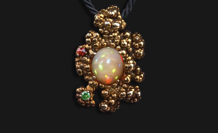 Ornella Iannuzzi: In the beginning, it was all so quiet Pendant. Made with hand-carved Wello opal (4cts) set in gold-plated silver, with garnet & tsavorite. from £1,700.